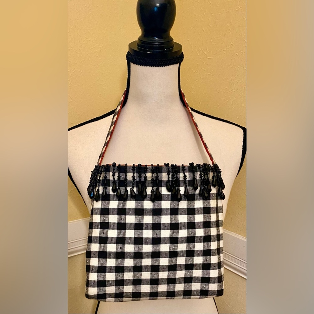 BLACK & WHITE Checkered Women's Bag; Reversible; Adorned with black tassels.